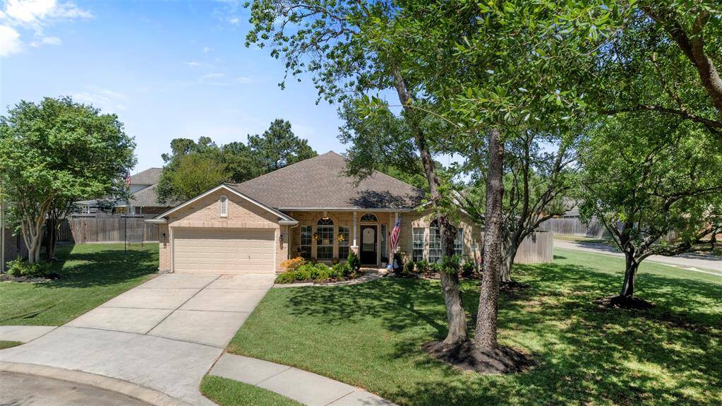 Charming corner-lot home with mature trees and great curb appeal.