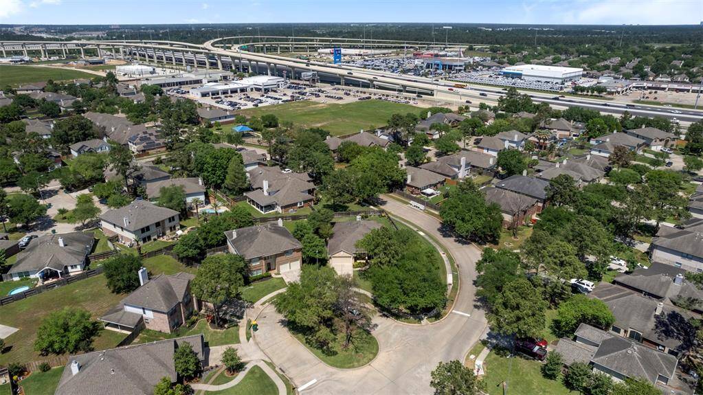 High aerial view showing home and easy access to 249 and 99.