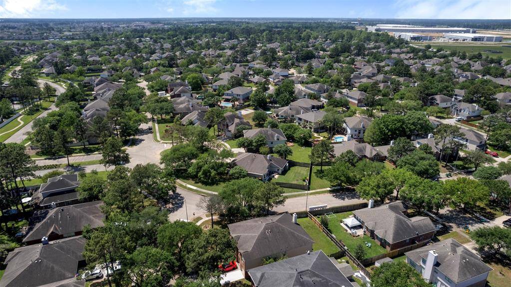 Wide view of tree-lined streets and residential area.