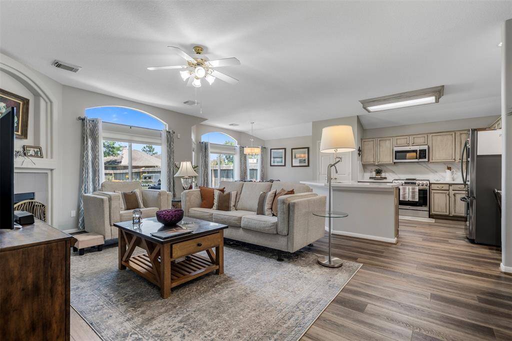 Open layout connects the living area to the kitchen, creating a seamless space for daily living.