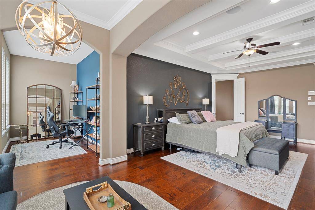Spacious and elegant, the primary suite includes a versatile bonus area perfect for a home office or reading nook.
