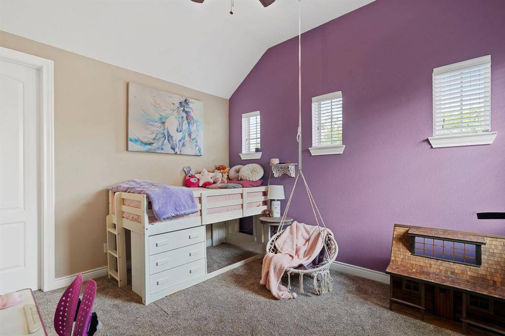 Bright and cheerful kid’s room with vaulted ceilings, playful color palette, and plenty of space to learn and play.
