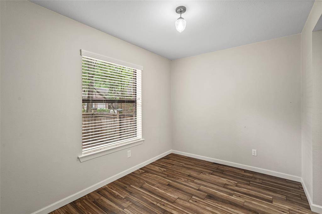 Your new dining room is bright and cheery with light-colored walls, easy to maintain tile flooring, and a window with blinds.