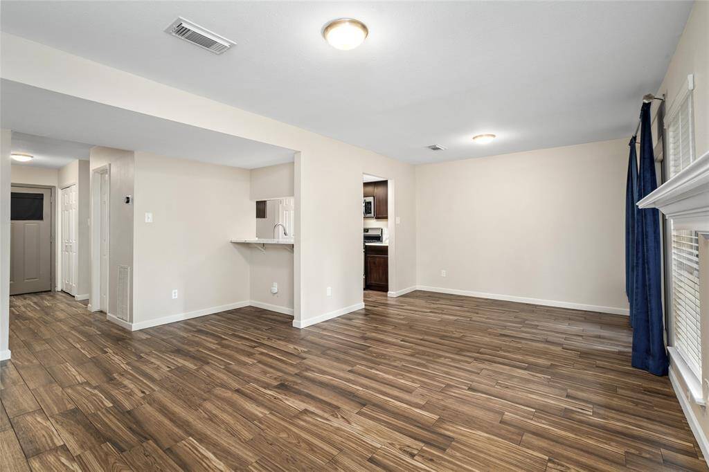 Another view of your bright, open-concept living area. Imagine all the possibilities in making this wonderful space into your sanctuary.