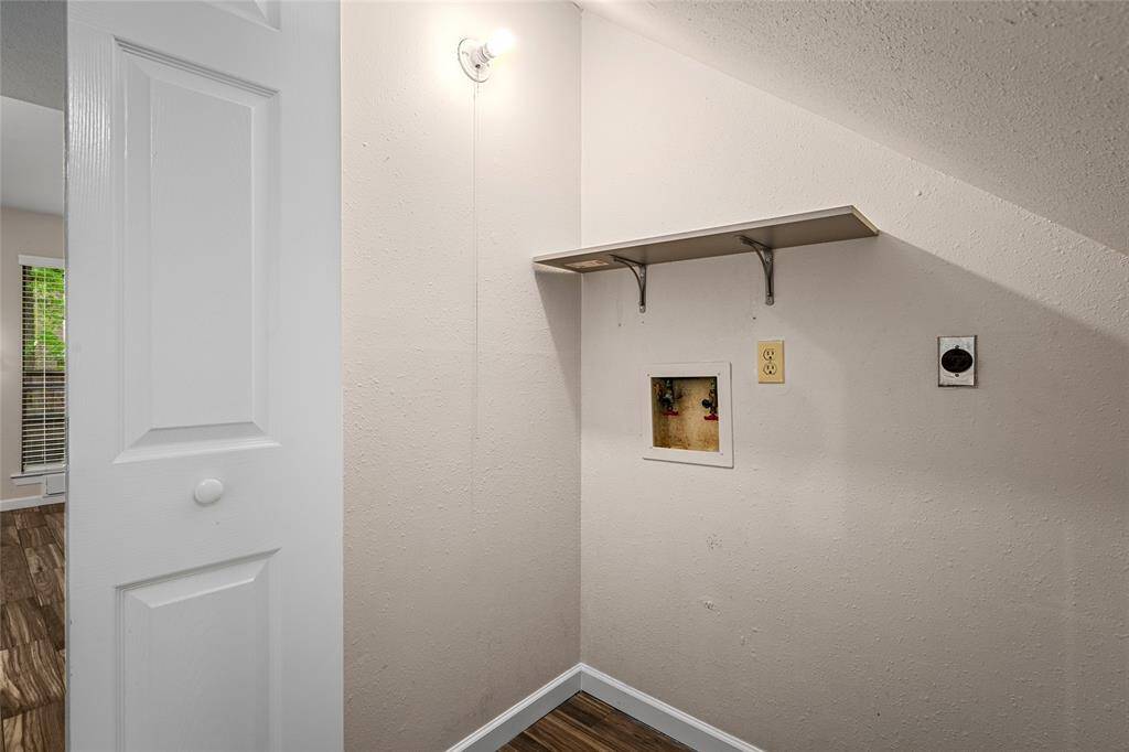 Your utility room has a built-in shelf and connections for laundry appliances.