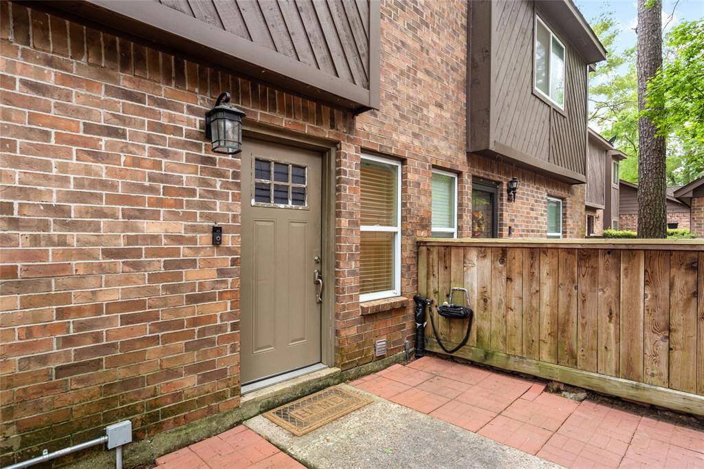 The entrance to your new townhouse has a solid front door, side window. The lantern-style lighting adds charm to the entryway.