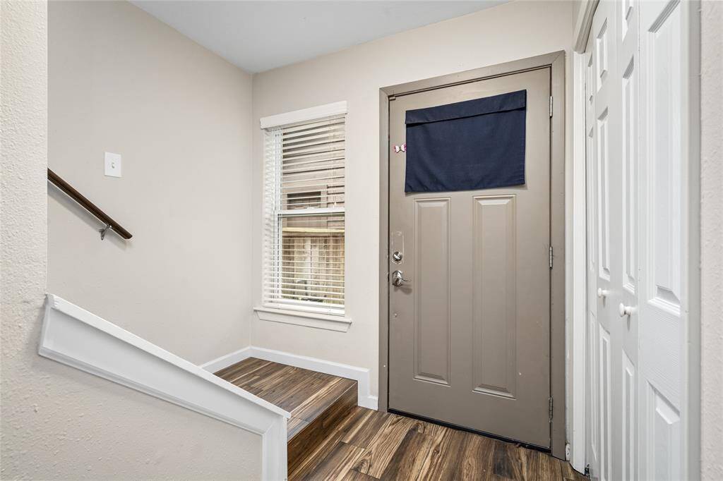 Your new entryway has tile flooring, neutral walls, and a window for natural light.