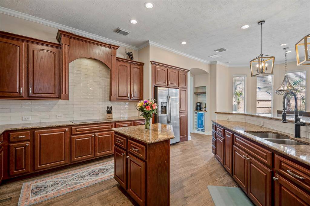 Nearby, a coffee bar area adds both style and functionality, perfect for entertaining guests.