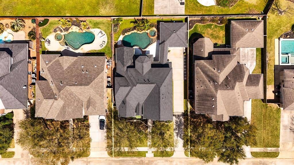 This home is ideally located in one of the top-rated master-planned communities in Northwest Houston, offering access to walking trails, community lakes, parks, and recreation centers. Aerial views highlight the expansive lot, private setting, and resort-style backyard, all within a neighborhood known for its family-friendly amenities and top-performing Klein ISD schools.
