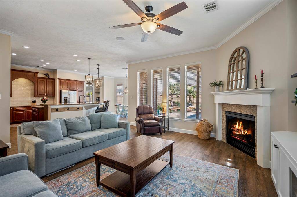 With seamless flow into the kitchen and breakfast area, this inviting living space is designed for both comfort and functionality.