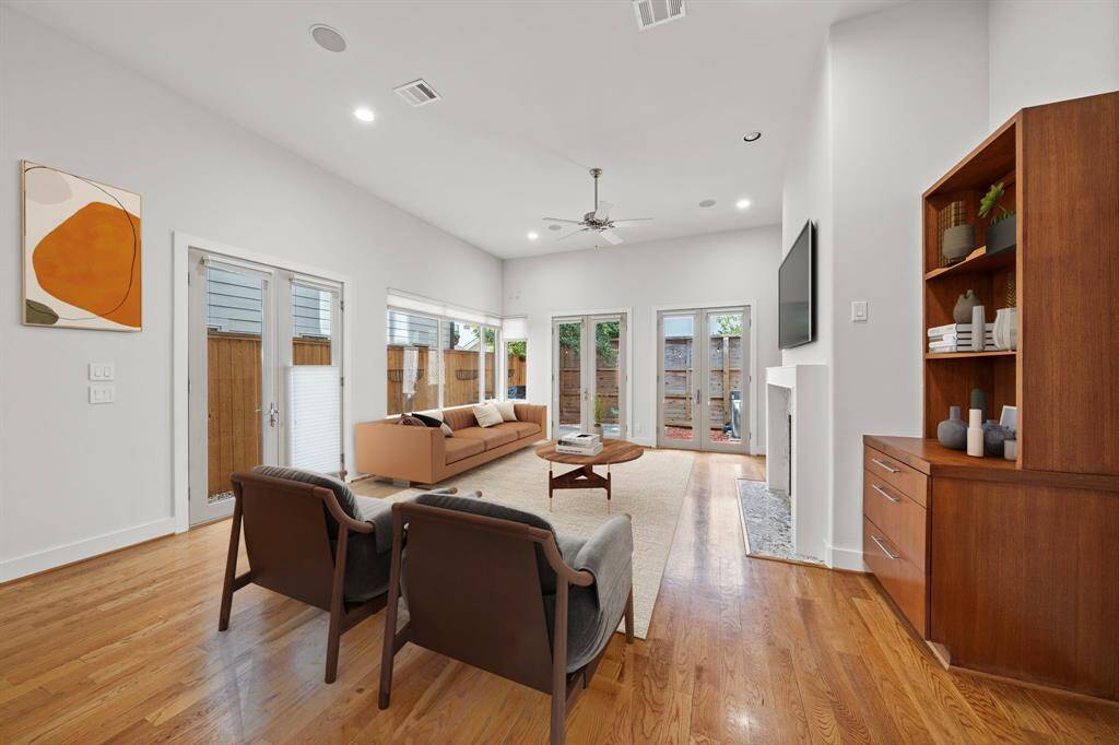 Living Room: All windows are adorned with custom Hunter-Douglas Duet adjustable shades
