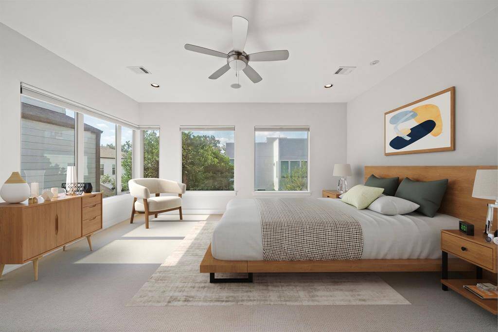 Luxurious corner Master Suite bathed in natural light, featuring panoramic windows and customizable Hunter Douglas shades for the perfect ambiance.
