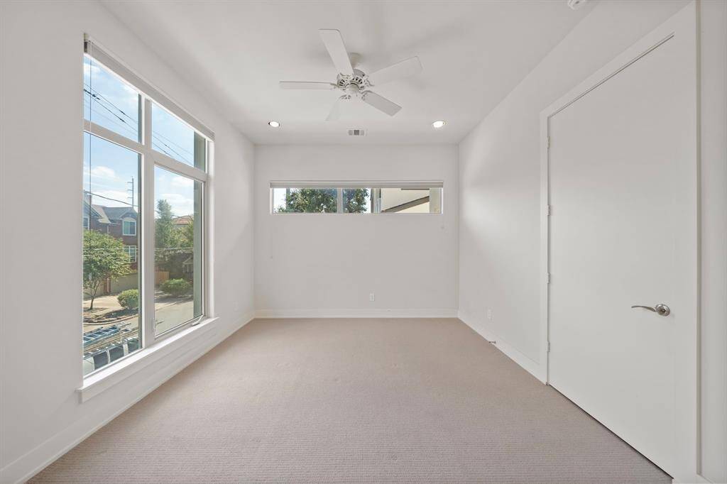 2nd Floor: Bedroom 2 with private full bath and personal patio space.