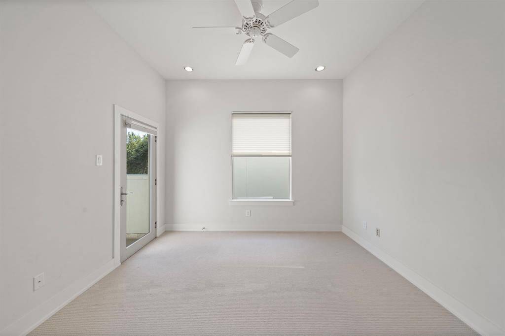 2nd Floor: Bedroom 2 with private full bath and personal patio space.