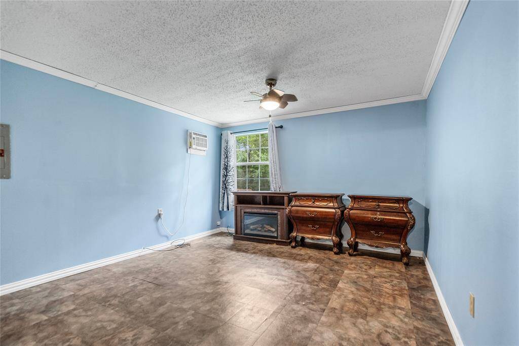 Spacious and serene, the primary bedroom offers a quiet retreat with large windows and built-in storage. A few enhancements could elevate this space into a relaxing owner’s haven.