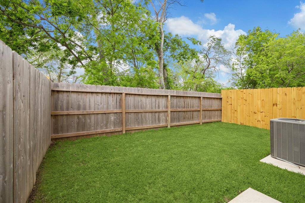 The fully fenced backyard has a concrete space and greenspace to enjoy the outdoors.