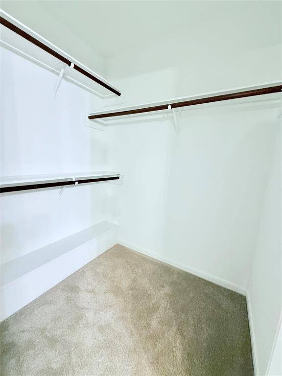 One of Two Primary Walk In Closets