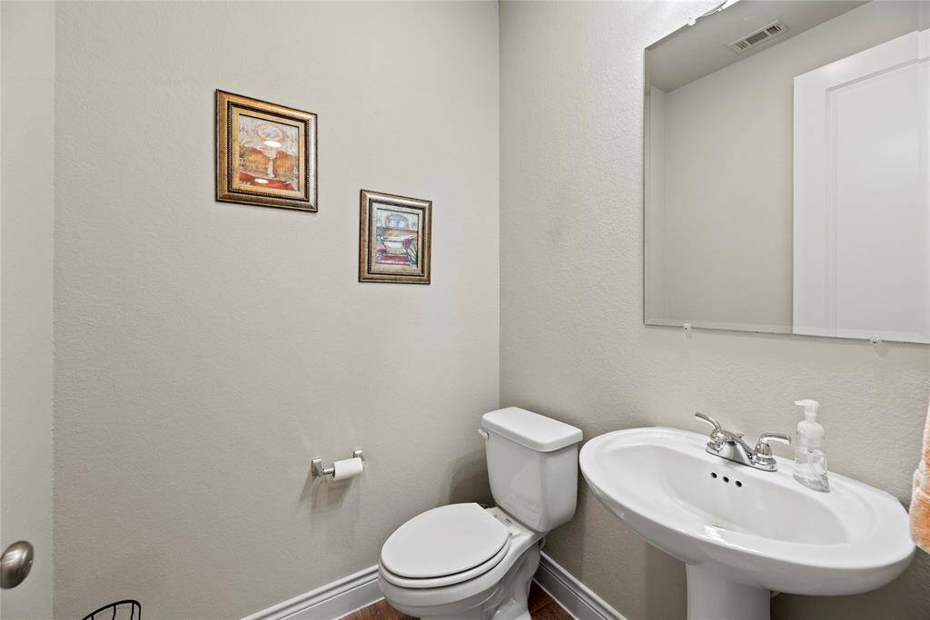 The guest bathroom is conveniently located just off of the family room.