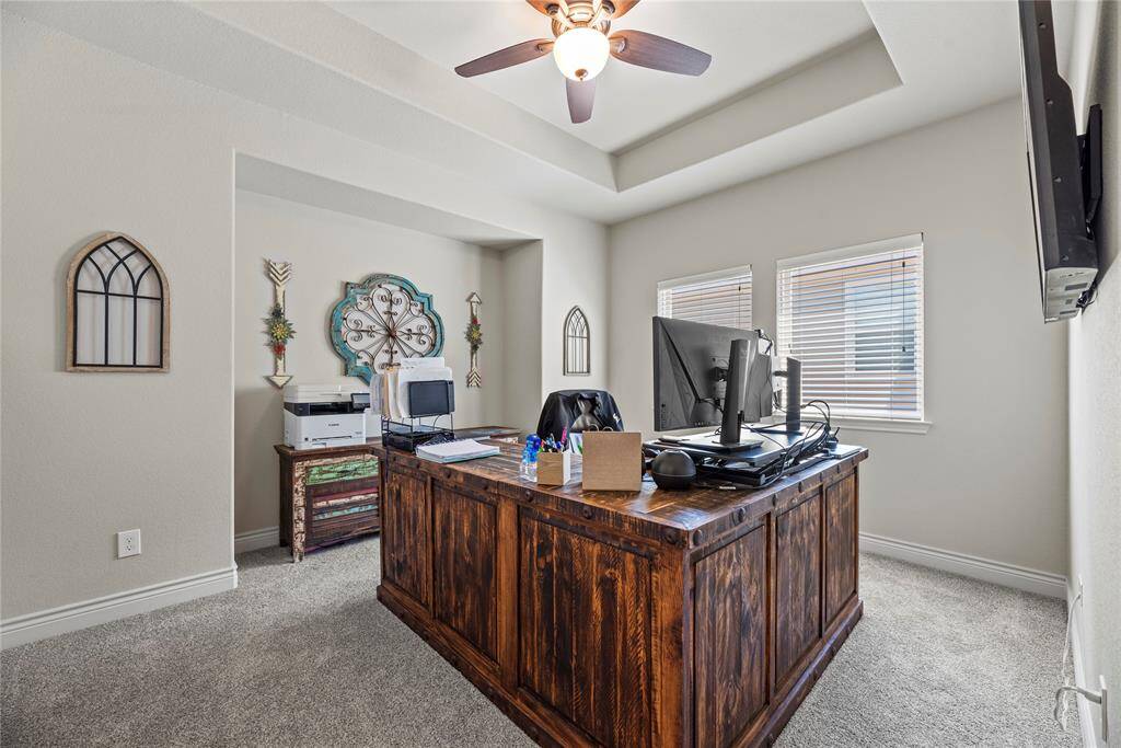This media room is being used as a home office.