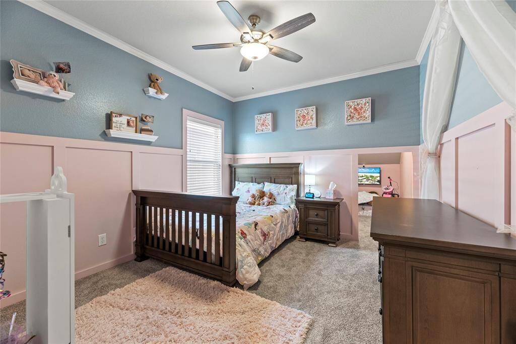This cozy children's bedroom features a charming color palette that just might be perfect for you.  A small adjoining play area adds extra space for fun!