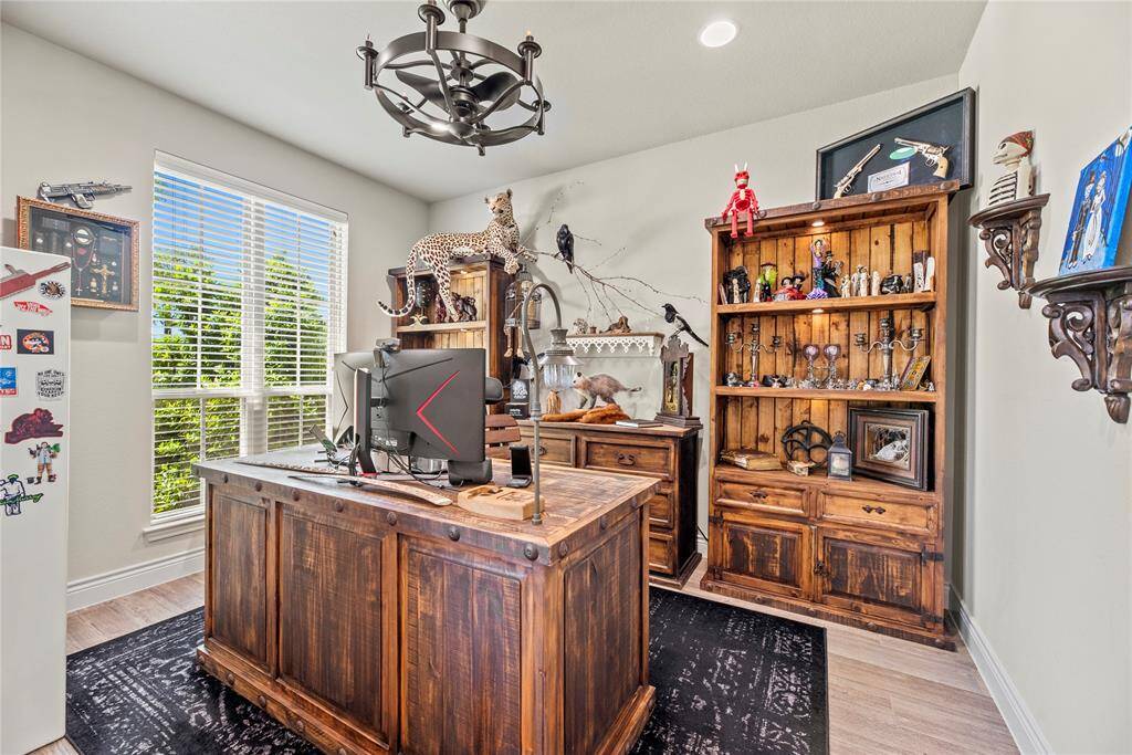 This home office features abundant natural light from the large pictures windows and is the perfect place to work from home!