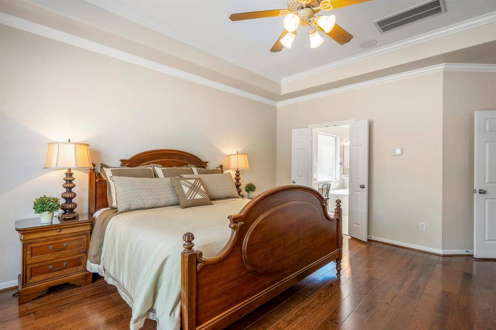 Moving further into the room and looking back, you get a glimpse into the primary bath, offering a preview of the luxurious amenities that await just beyond the suite.