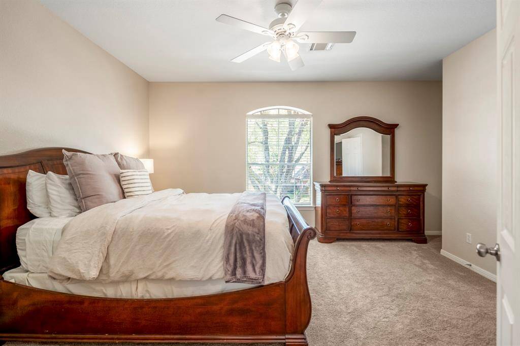 Adjacent to the game room, this spacious upstairs bedroom features a cozy nook to the right, perfect for a reading corner or small desk. The room also boasts a huge walk-in closet, offering plenty of storage space.