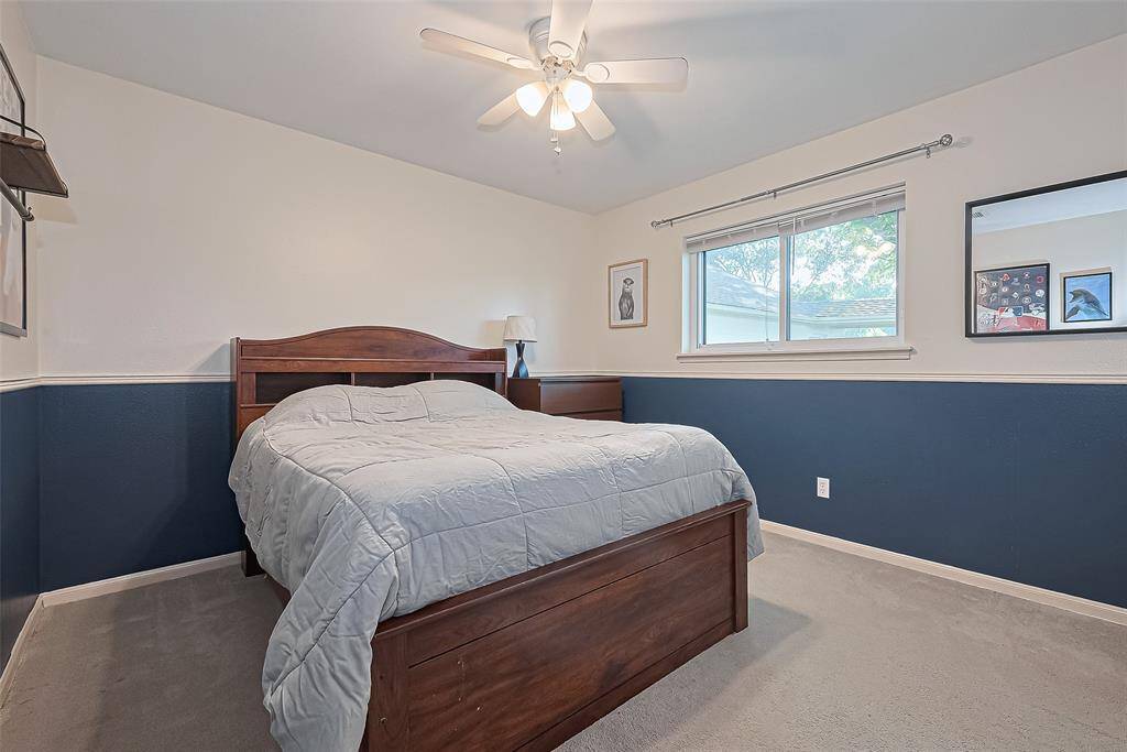 Step into the third inviting guest bedroom that offers a generous layout and a large window that fills the space with natural light—perfect for creating a bright, peaceful retreat to start and end your day.