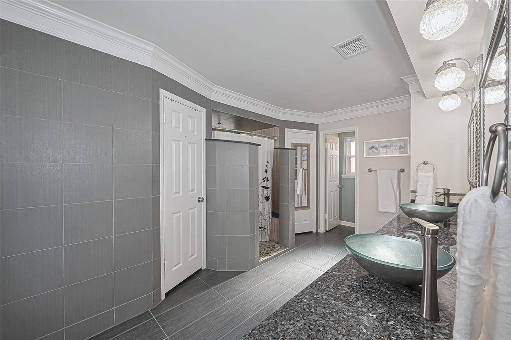 The layout offers incredible flow, with private access to the shower, ample storage, and a seamless connection to the rest of the suite—making mornings smoother and evenings more relaxing.