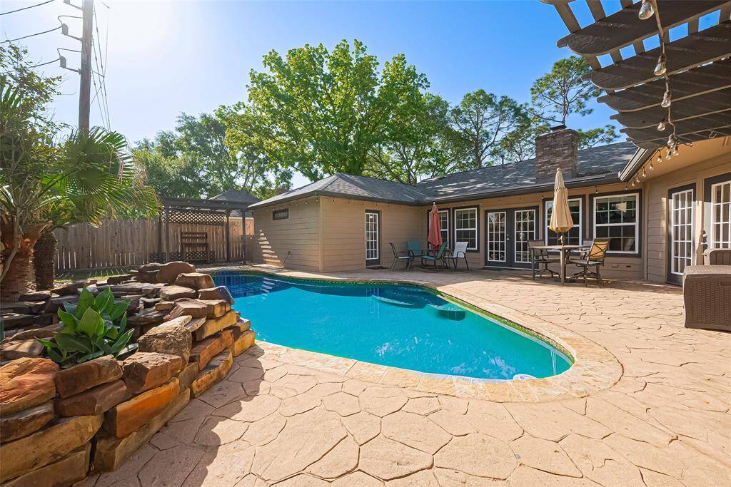 Step into your own private backyard oasis featuring a sparkling 3’–5’ deep swimming pool with a stunning rock waterfall. Enjoy relaxing days under the sun and fun night swims with the color-changing pool light creating the perfect evening ambiance.