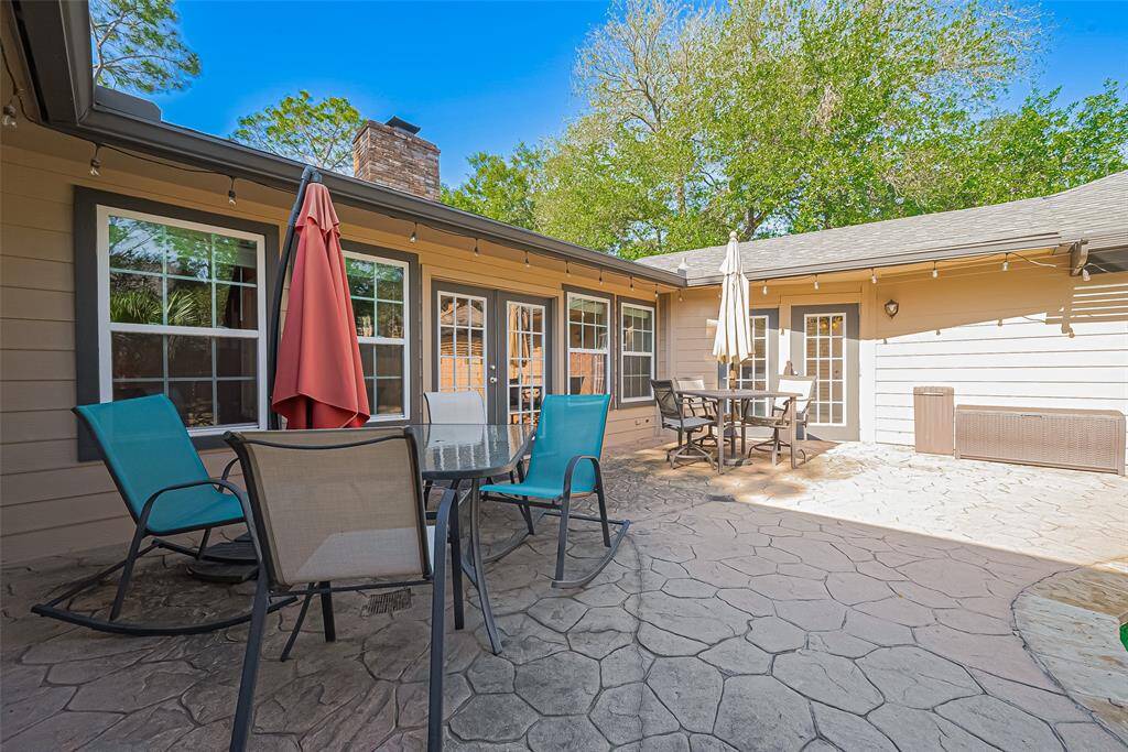 This expansive patio is made for memory-making—whether it's weekend BBQs, evening conversations under the string lights, or simply soaking in the sunshine, there's plenty of space here for family and friends to gather, relax, and enjoy the great outdoors together.