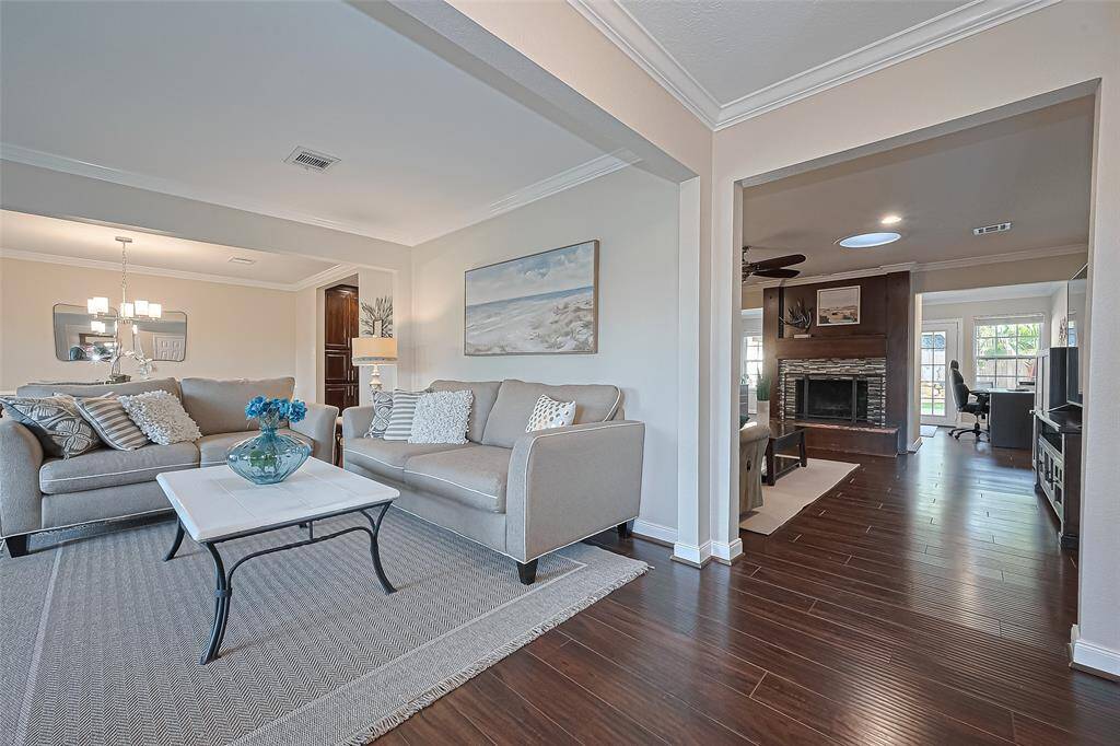 From the moment you step inside, this home delights with charming details—from elegant crown molding and rich wood floors to inviting living spaces that flow seamlessly for everyday comfort and entertaining.
