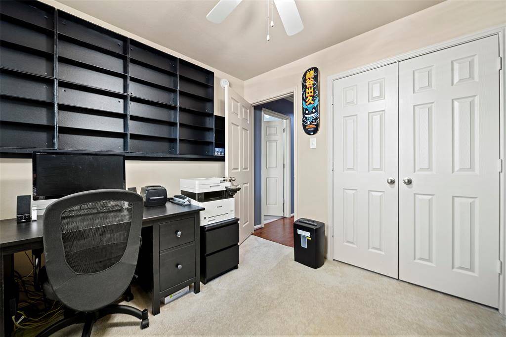 Another view of the office and shelving.