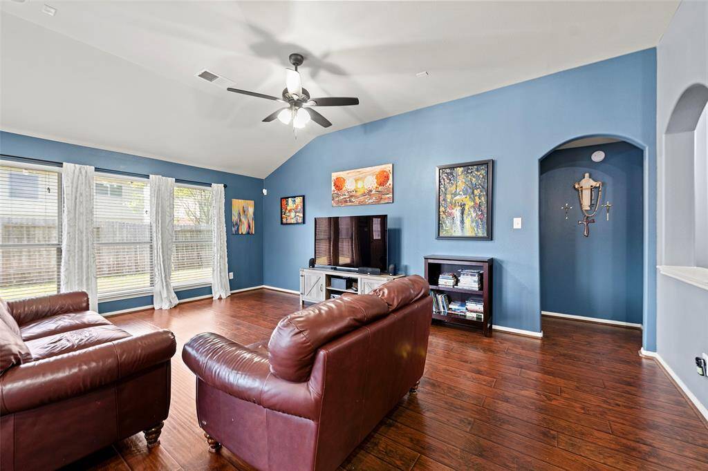 Another view of the living room going towards the primary bedroom.
