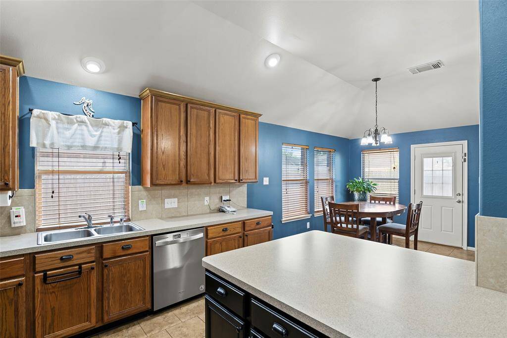 The island overlooking the breakfast eating area is the perfect place to prepare for meals or entertaining guests.