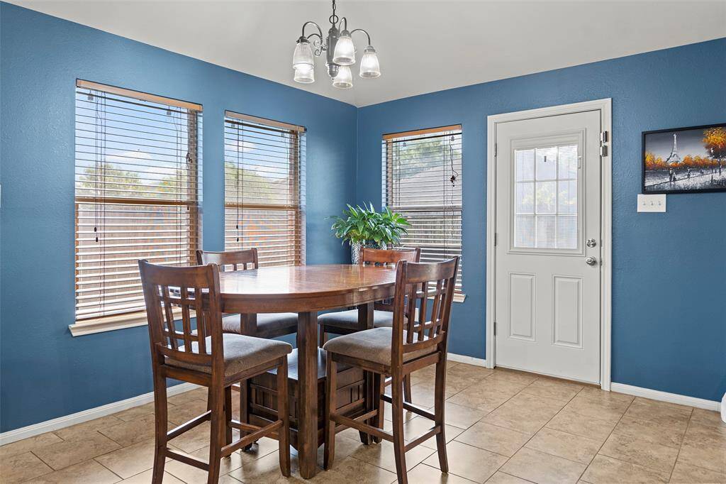 Breakfast eat in area  with tile flooring.