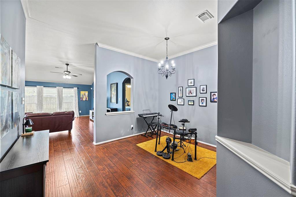 As you walk into the home you are greeted by this formal dining room. Currently being used as a music practice area.