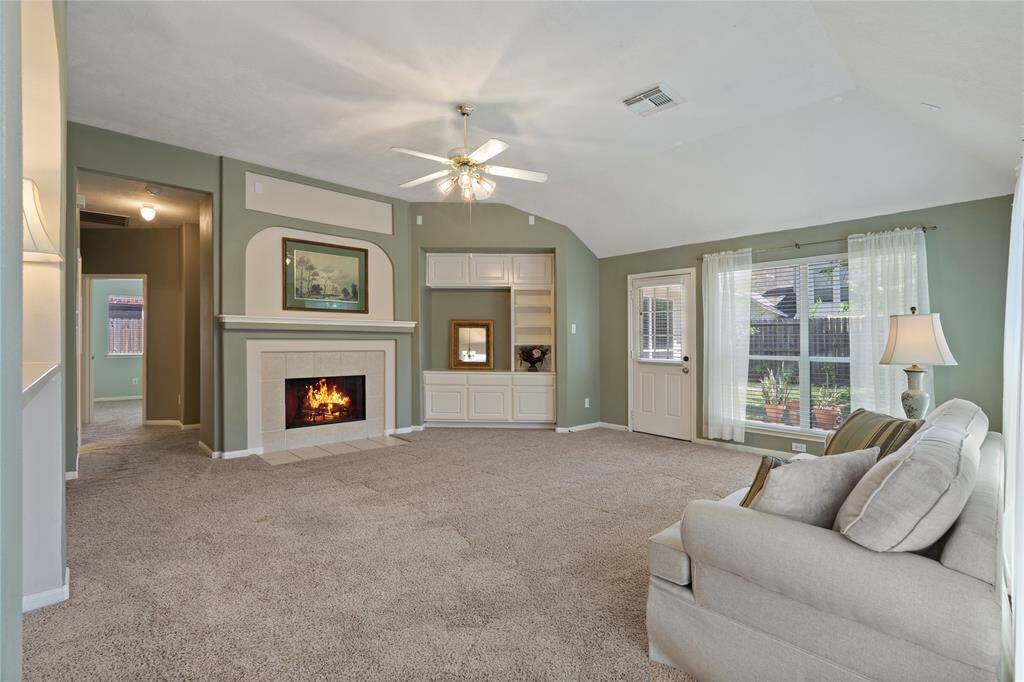 Sit back and relax while enjoying this luxurious fireplace in the extra-large living room.