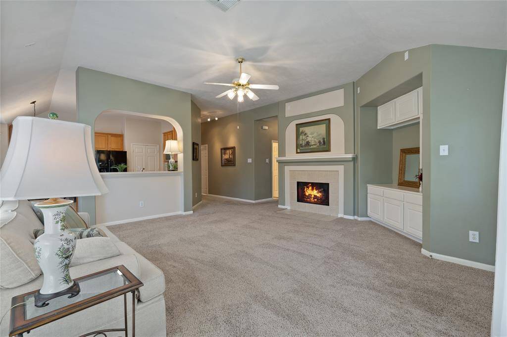 The living room is nicely located next to the kitchen. It is perfectly designed for entertaining.