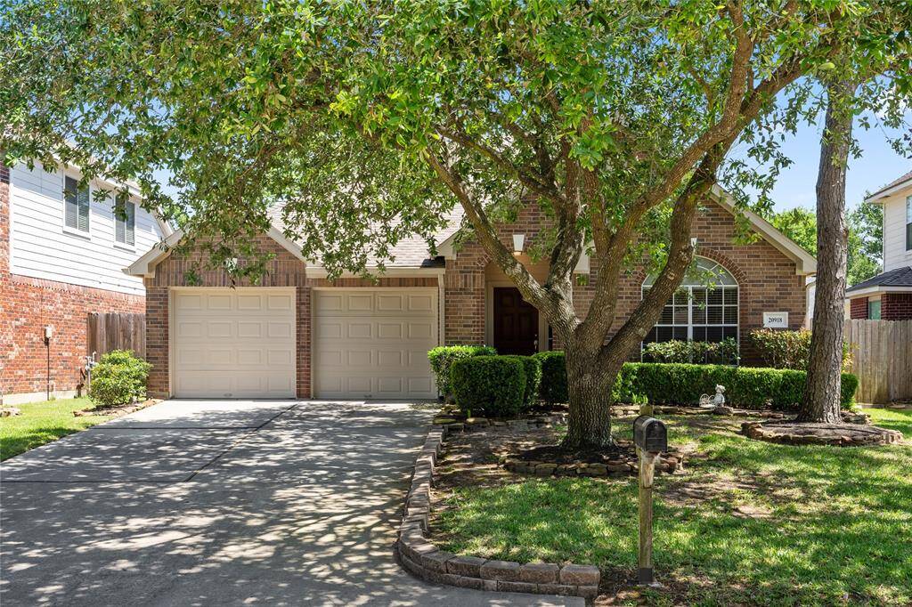 Mature trees in the front yard offers natural shade and enhances the home's curb appeal.
