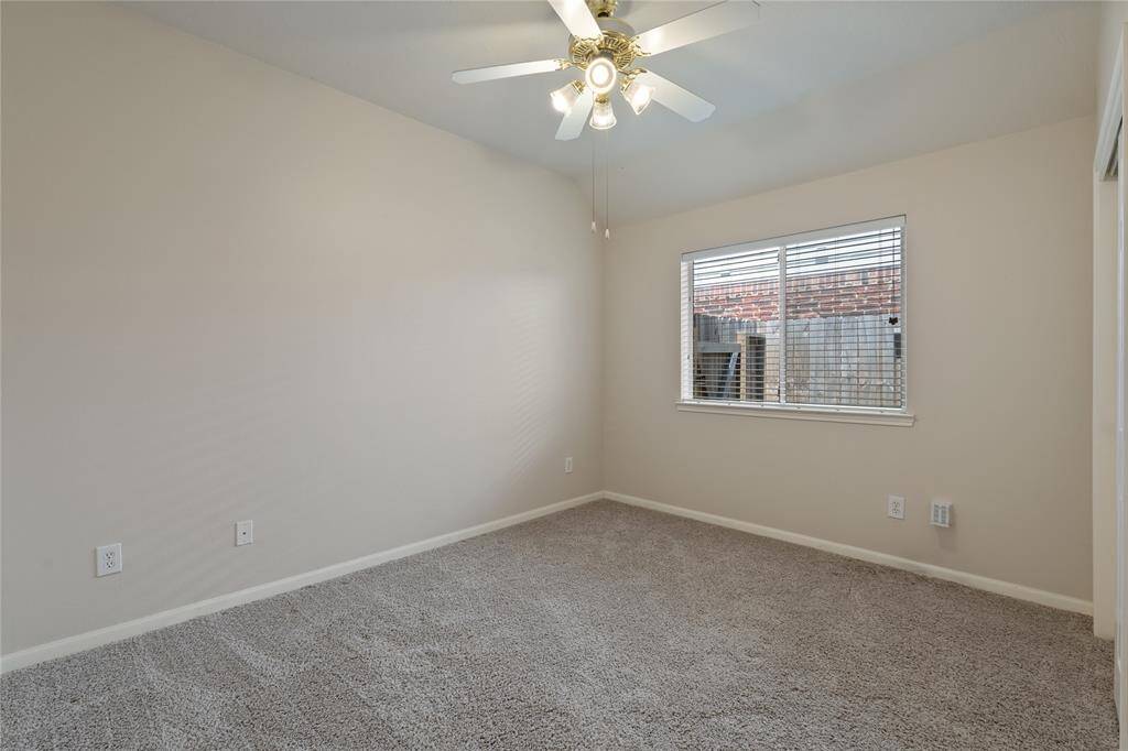 Secondary bedroom offers high ceilings and lots of space for a complete bedroom set.