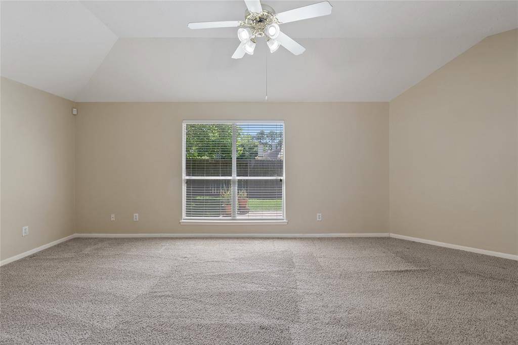 Such a lovely view of the backyard from the window of the primary bedroom.