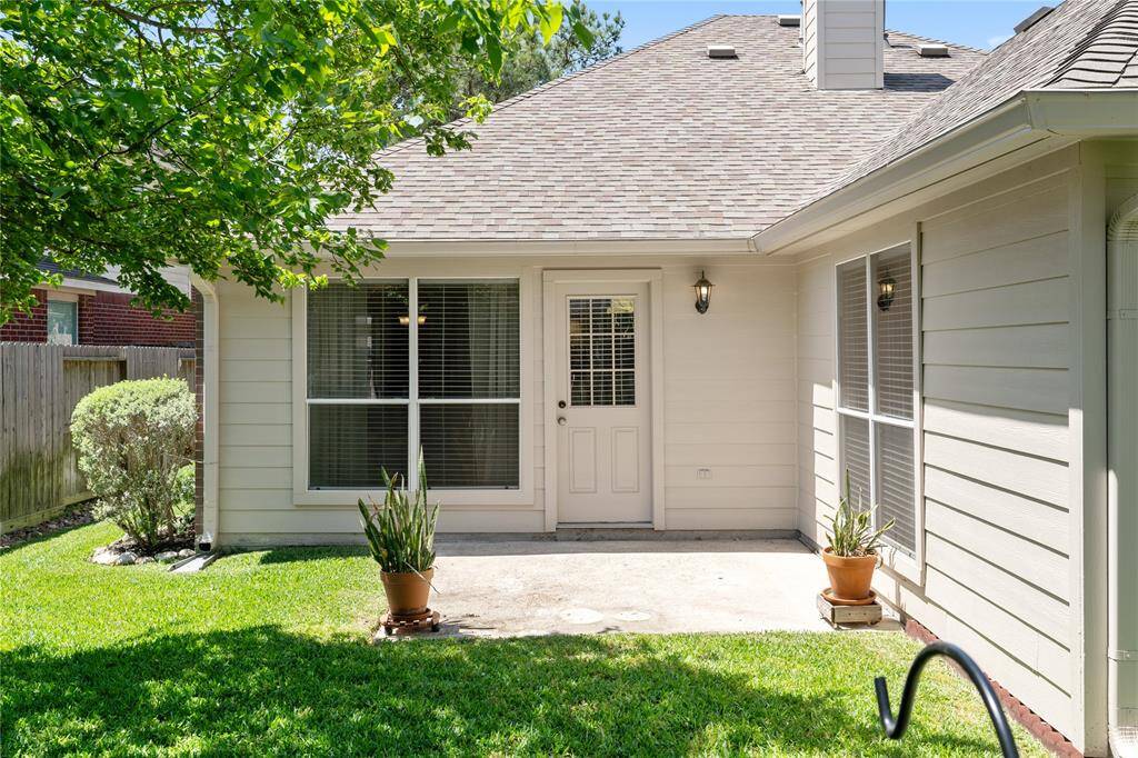 The back porch is a great spot to put your favorite patio set and relax while watching the kids or pets play.
