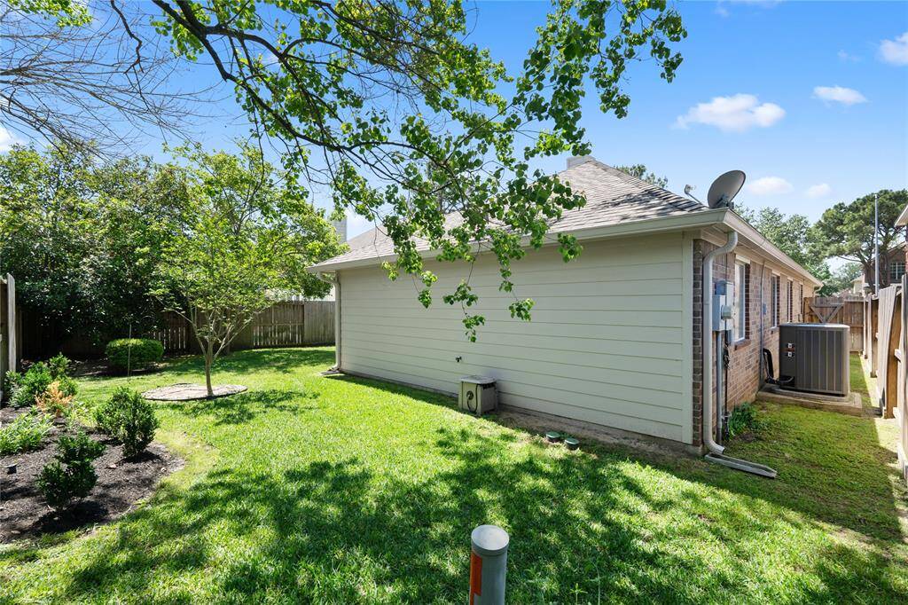 Enjoy the beautifully landscaped trees, providing both privacy and much needed shade.
