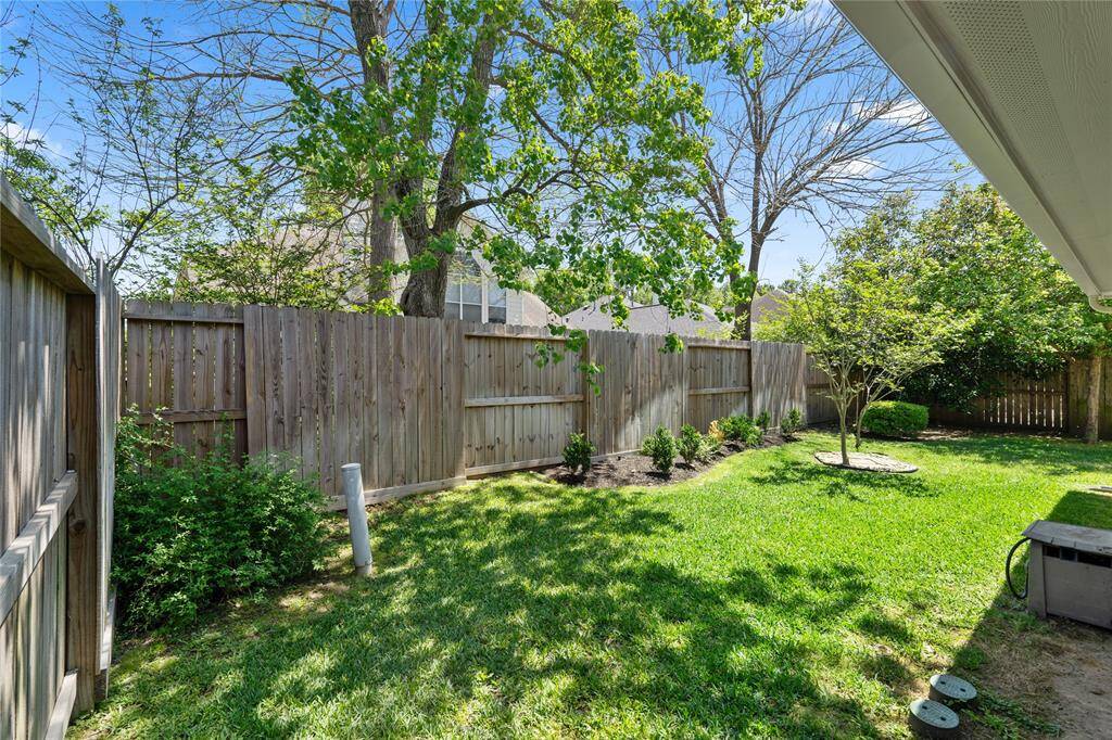 The side yard offers ample space for additional storage, outdoor toys, and extra gardening.