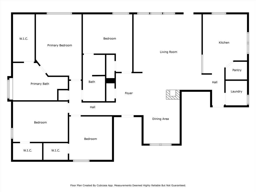 This floor plan features a spacious layout with four bedrooms, including a primary suite with a walk-in closet and private bath. The open-concept living and dining area connects to a well-sized kitchen with a pantry. There’s also a separate laundry room and an additional bathroom.