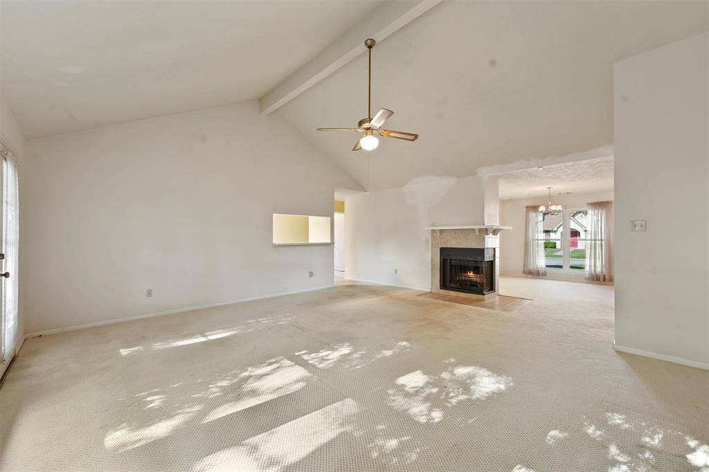 This inviting living room seamlessly flows into the front dining area and kitchen, perfect for entertaining.