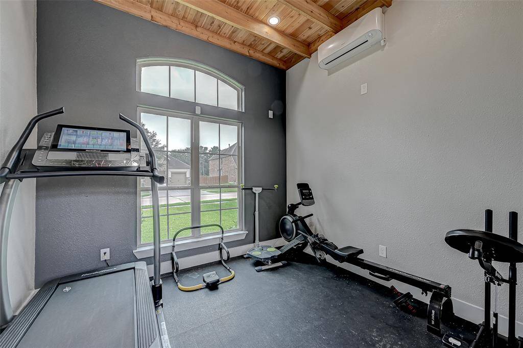 Separate exercise room outside the kitchen door with a half bath.