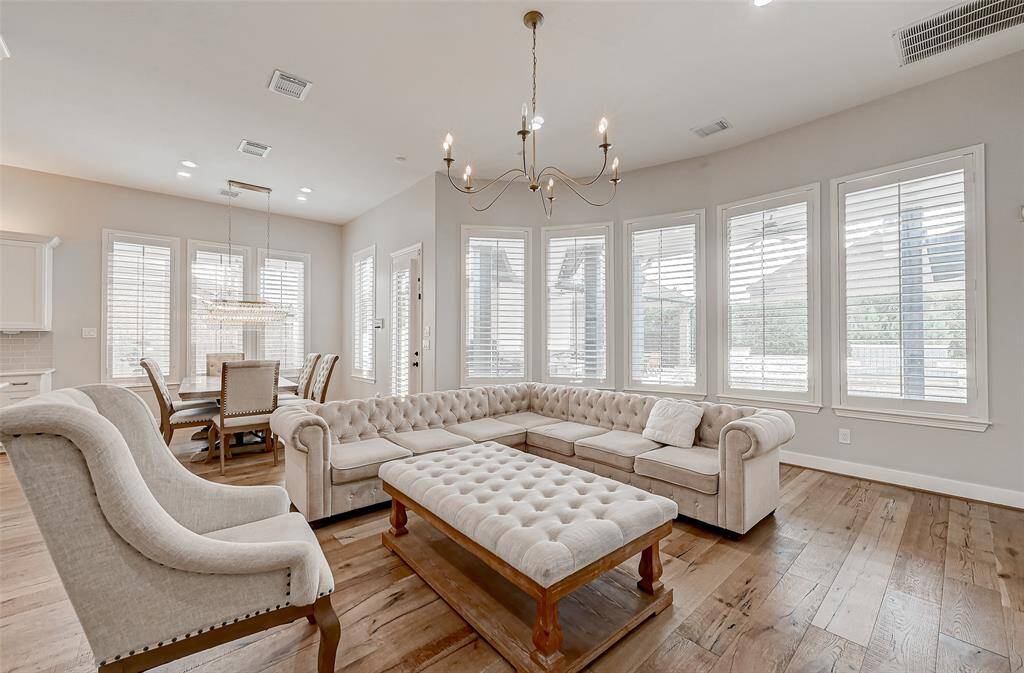 Open living space with view to kitchen and eating area.