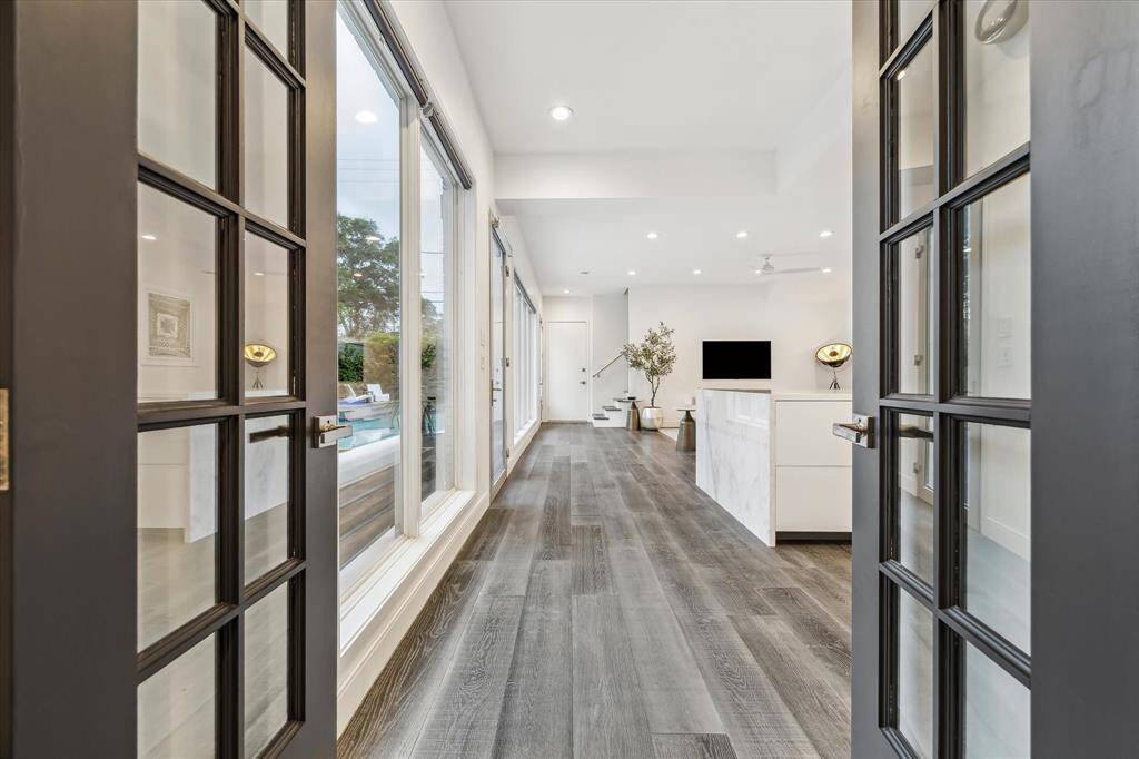 The kitchen is the heart of the home, featuring a spacious open-concept design that flows seamlessly into the living area—perfect for entertaining. Induction cooktop, Sub Zero refrigerator and Bosch appliances